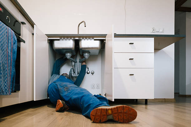 Professional Emergency Plumber technician working in Thompson, ND